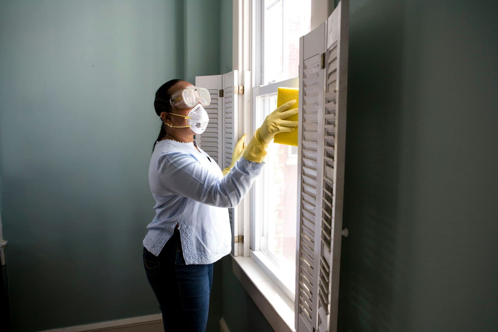 Cleaner washing a window